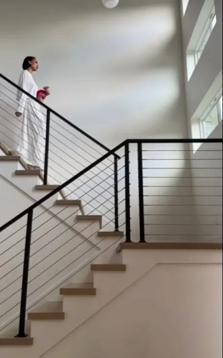 The home has modern touches, including a black railing