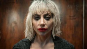 Lady Gaga wears the faded face makeup of Harley Quinn in Joker: Folie a Deux.