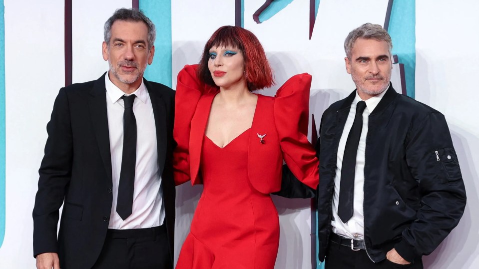 Director Todd Phillips poses with lead stars Gaga and Phoenix