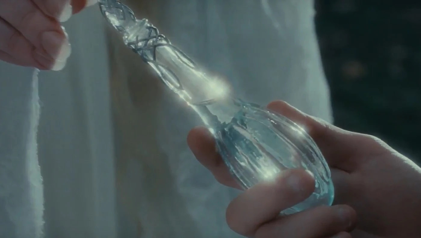 Galadriel handing a phial of starlight to Frodo