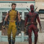 Hugh Jackman and Ryan Reynolds walk down a street in Deadpool & Wolverine