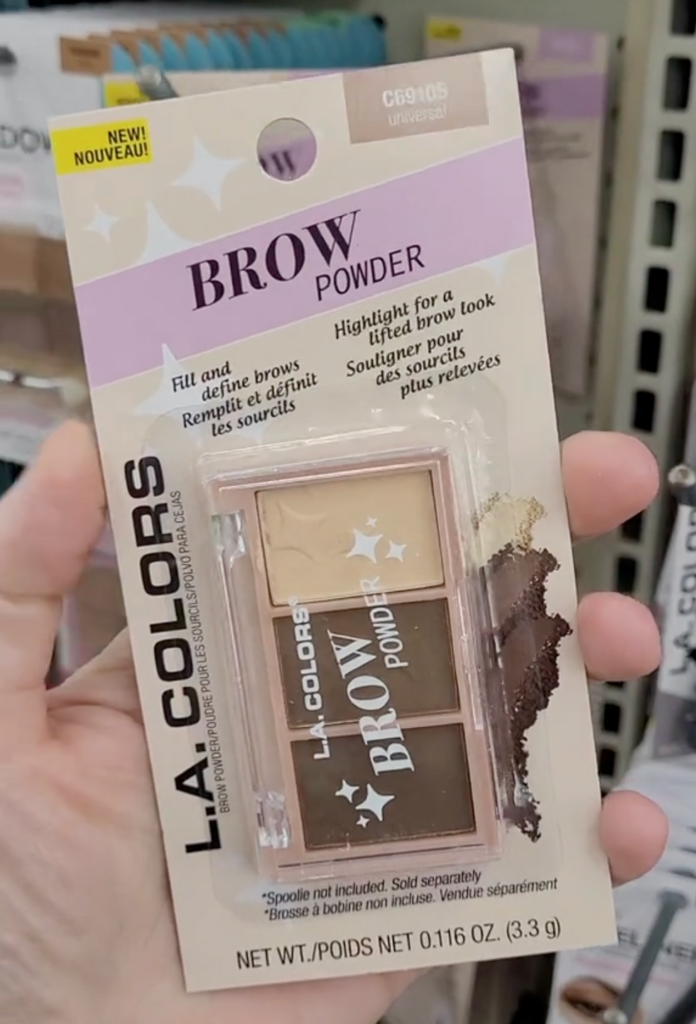 shopper holding up brow powder at Dollar Tree