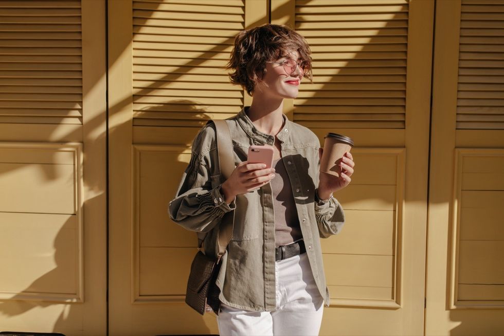 woman in olive colored jacket