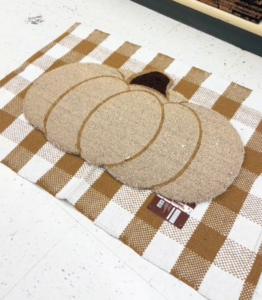 pumpkin-shaped doormat at Hobby Lobby