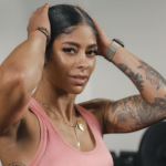 Fitness Star Massy Arias in Two-Piece Workout Gear Says "Train Legs With Me"