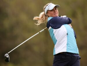 Influencer Carly Booth in Two-Piece Workout Geat Does "Putting Practice"