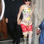 Lady Gaga wore four different outfits in less than 24 hours, pictured in an emoji top with partner Michael Polansky