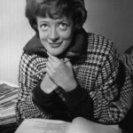 Smith in 1963, reading a script shortly after she was named Stage Actress of the Year by the Variety Club of Great Britain.