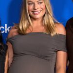 Margot Robbie showed off her baby bump in a glam bodycon dress