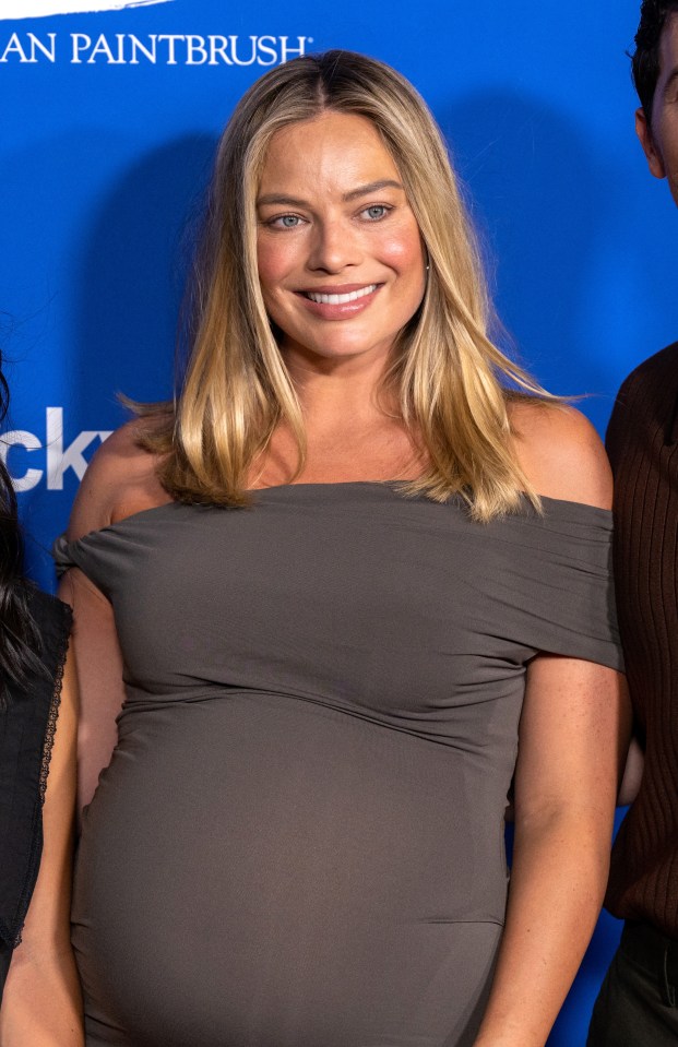 Margot Robbie showed off her baby bump in a glam bodycon dress