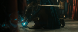 Elendil (Lloyd Owen) grabs a palantír in Rings of Power season 2 as it shoots out some kind of power