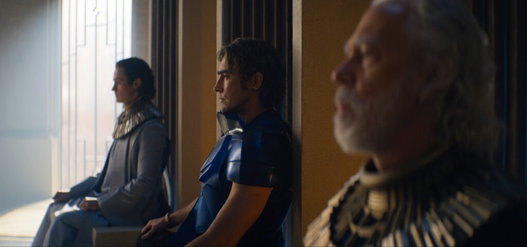 Cassian Bilton, Lee Pace and Terrence Mann as Brother Dawn, Brother Day, and Brother Dusk, the triumvirate personage Empire in Foundation.