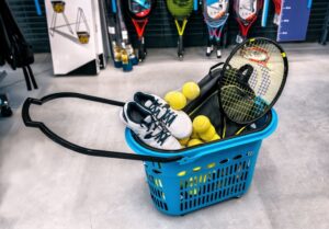 basket with tennis sports goods in the supermarket