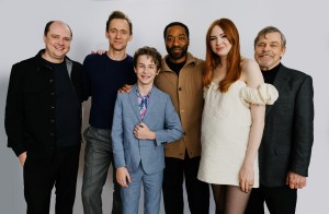 Mike Flanagan, Tom Hiddleston, Benjamin Pajak, Chiwetel Ejiofor, Karen Gillan and Mark Hamill pose for a group portrait in front of a white backdrop.