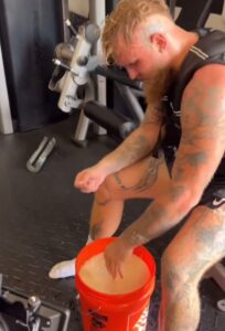 Jake Paul showed off his hand strengthening exercise using a bucket of rice