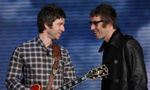 Noel and Liam Gallagher smiling at each other