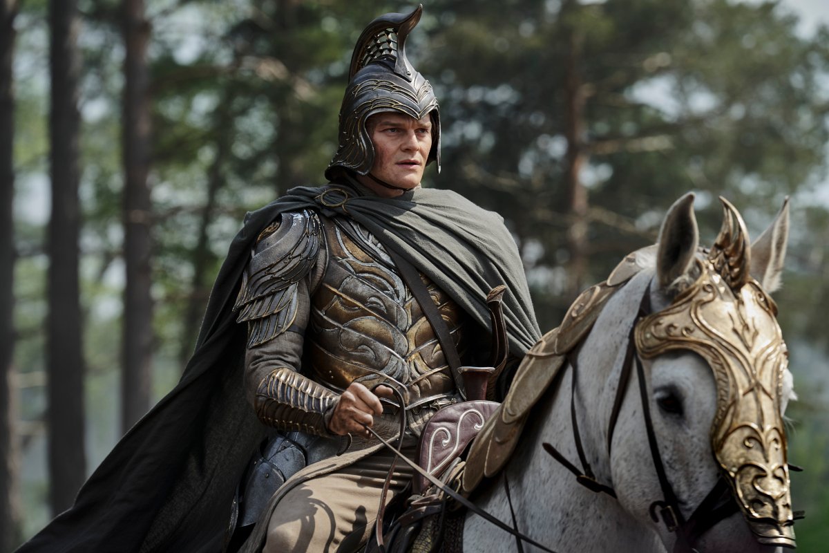 Elrond in armor riding a horse in The Rings of Power season two