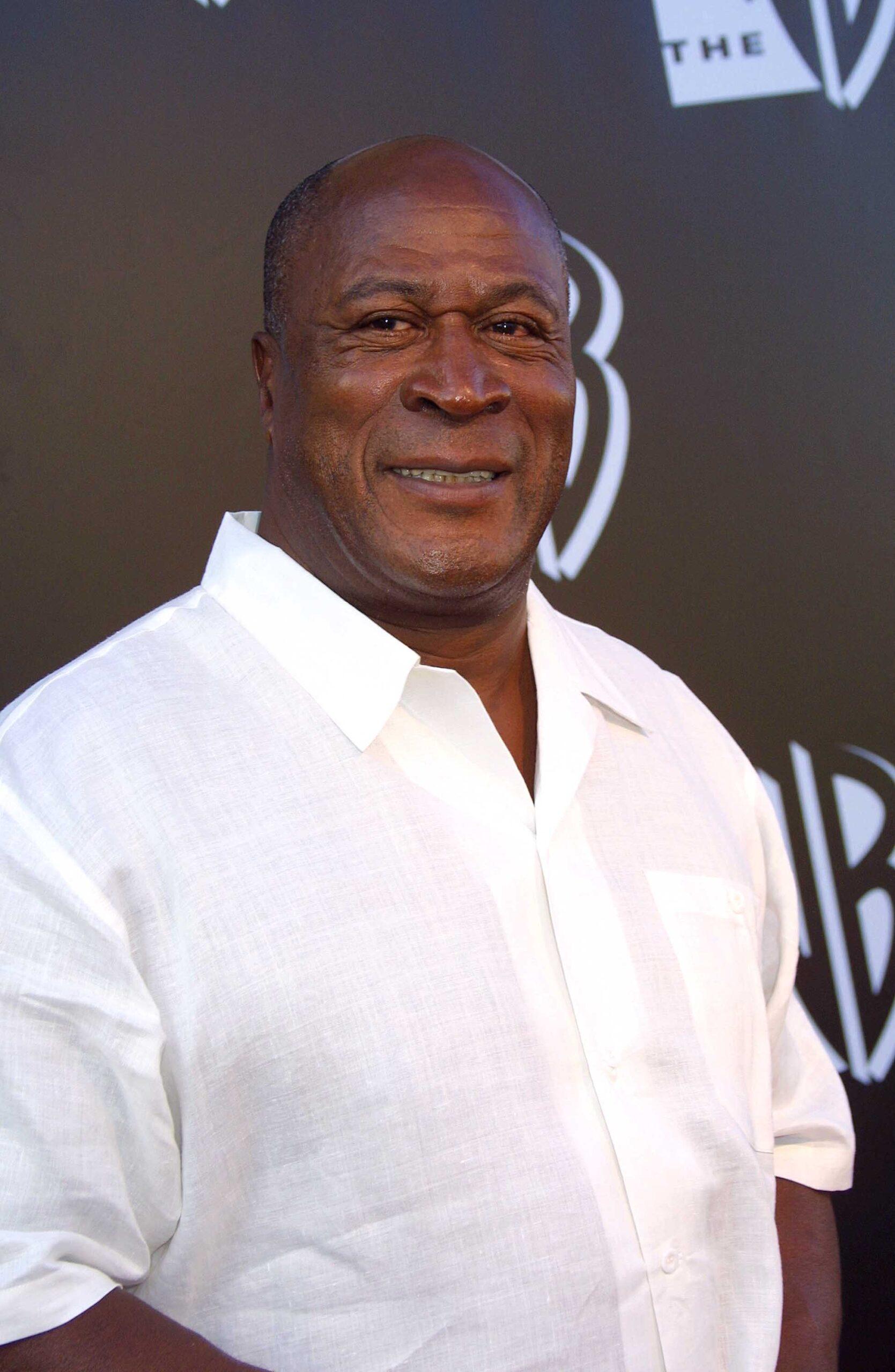 John Amos wearing a white shirt