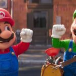 Mario and Luigi raise their arms in triumph in The Super Mario Bros. Movie