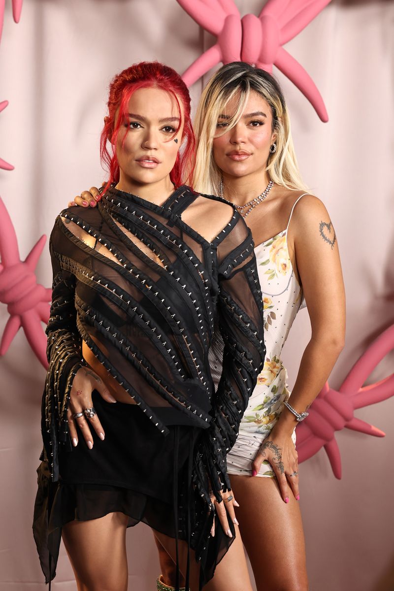  Karol G Strikes A Pose With Her Two New Wax Figures at Madame Tussauds on October 04, 2024, in New York City. (Photo by Jamie McCarthy/Getty Images for Madame Tussauds )