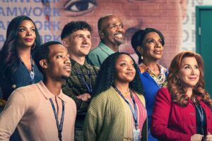 A cast photo of Abbott Elementary with everyone looking to the side together