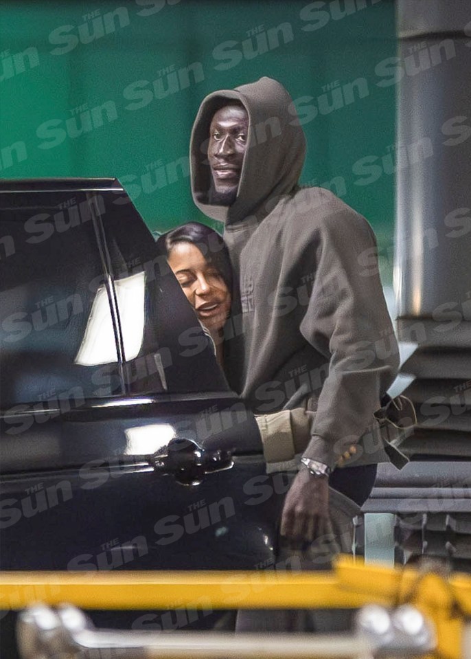 Victoria gave a smiling Stormzy a squeeze beside a car