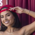 Becky G lifts her hand to her head on the set of her music video "Otro Capitulo," being filmed in Elysian Park