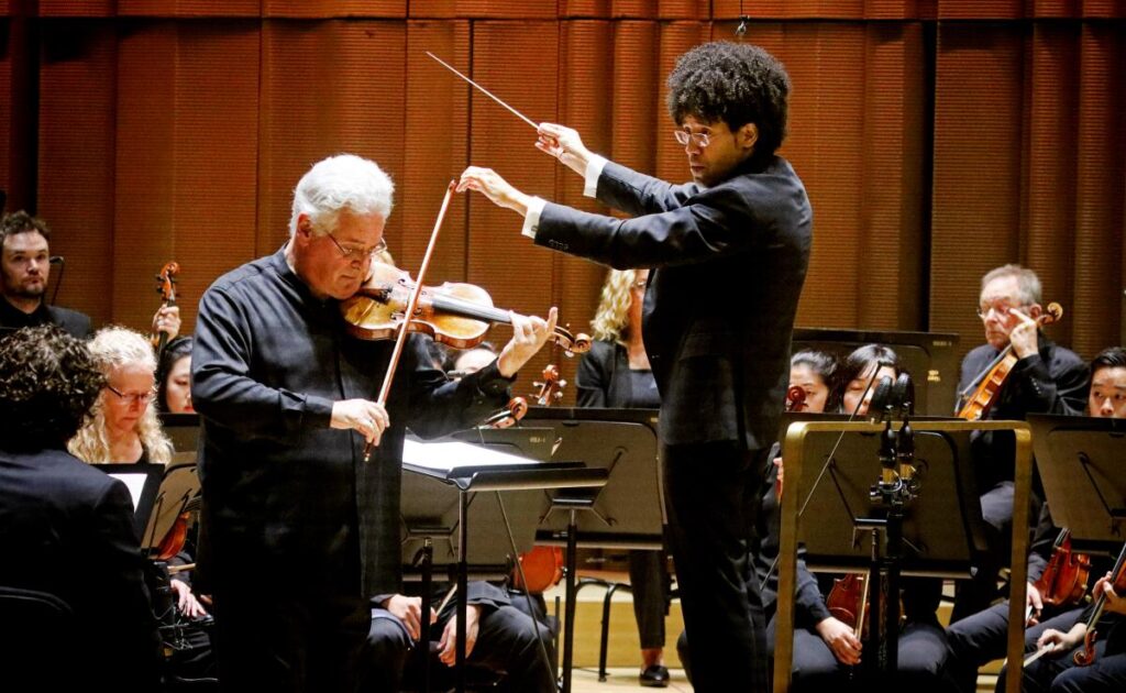 Violinist Pinchas Zukerman and conductor Rafael Payare performing Beethoven's Violin Concerto