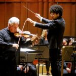 Violinist Pinchas Zukerman and conductor Rafael Payare performing Beethoven's Violin Concerto