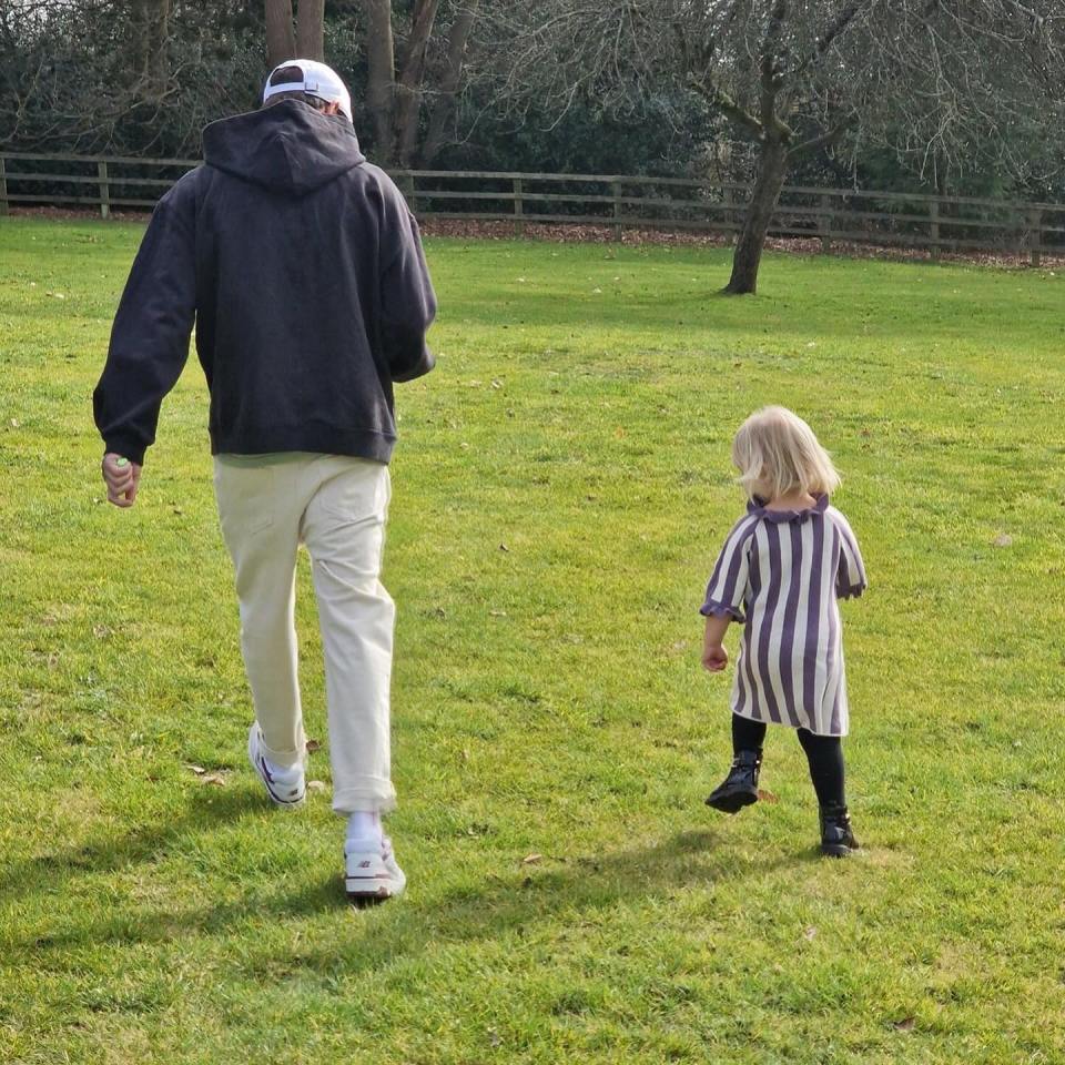 Liam was seen running with his niece in a poignant picture