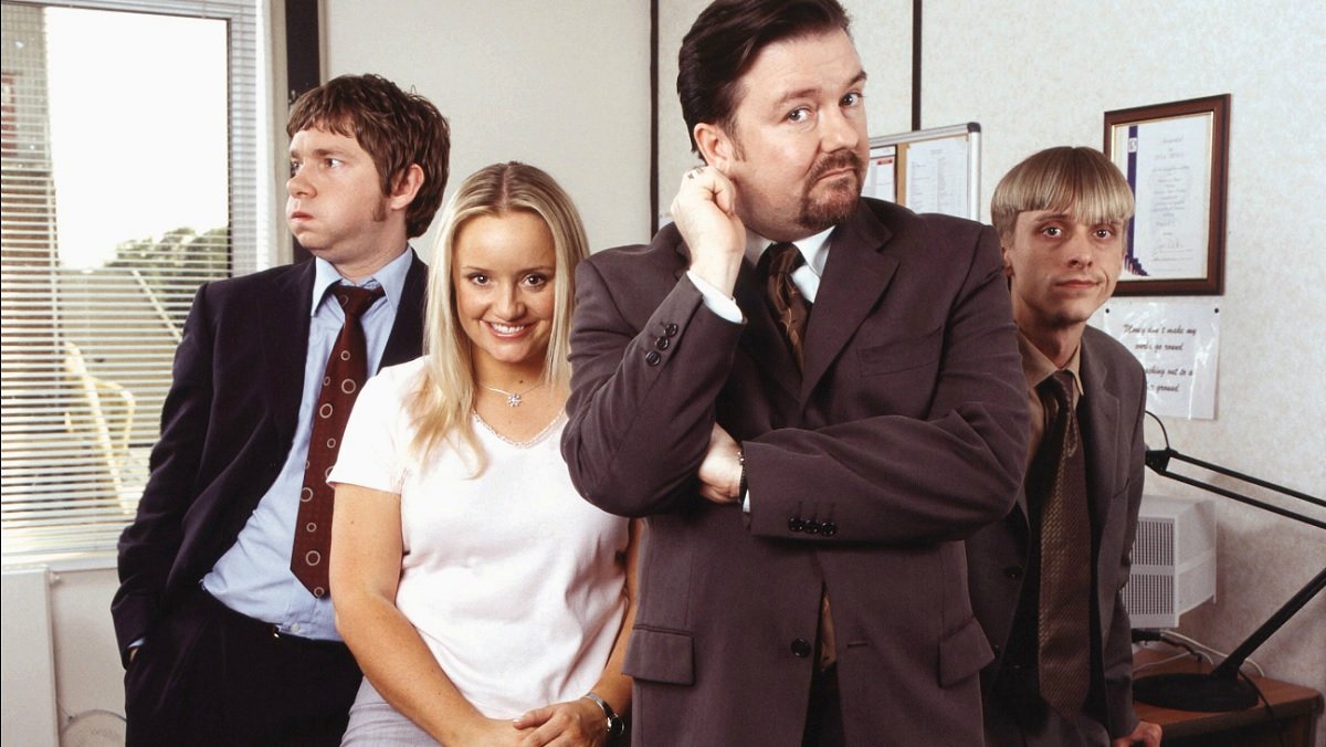 The cast of the original British The Office in a promo image.