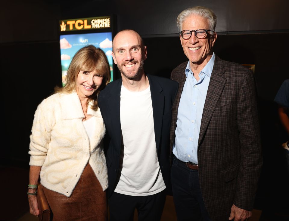 Charlie pictured with his mum and stepfather at the red carpet event