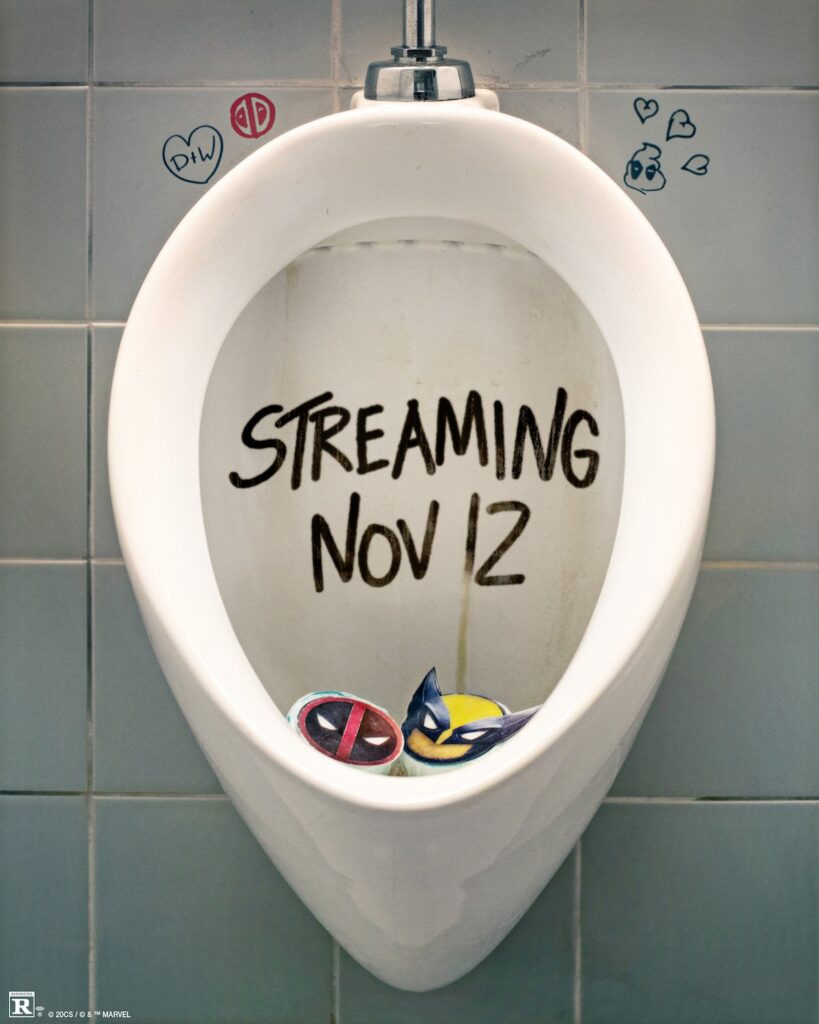 Urinal with Deadpool and Wolverine decals in the bottom with the date of its Disney+ streaming in the middle