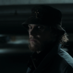 Ralph Bohner (Evan Peters) standing in a dark parking garage looking sad in Agatha All Along