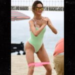 1007-Alessandra-Ambrosio-Playing-Volleyball-in-a-green-thong-swimsuit-primary-3