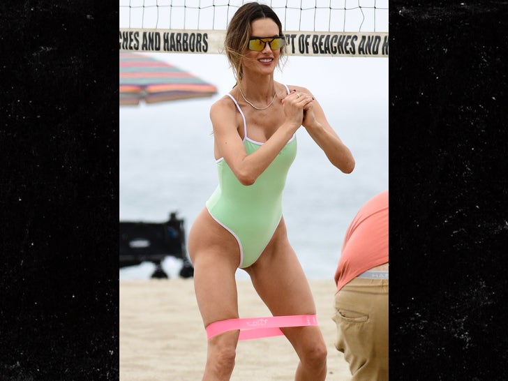 1007-Alessandra-Ambrosio-Playing-Volleyball-in-a-green-thong-swimsuit-primary-3