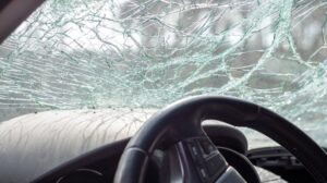 Damaged car window after crash accident