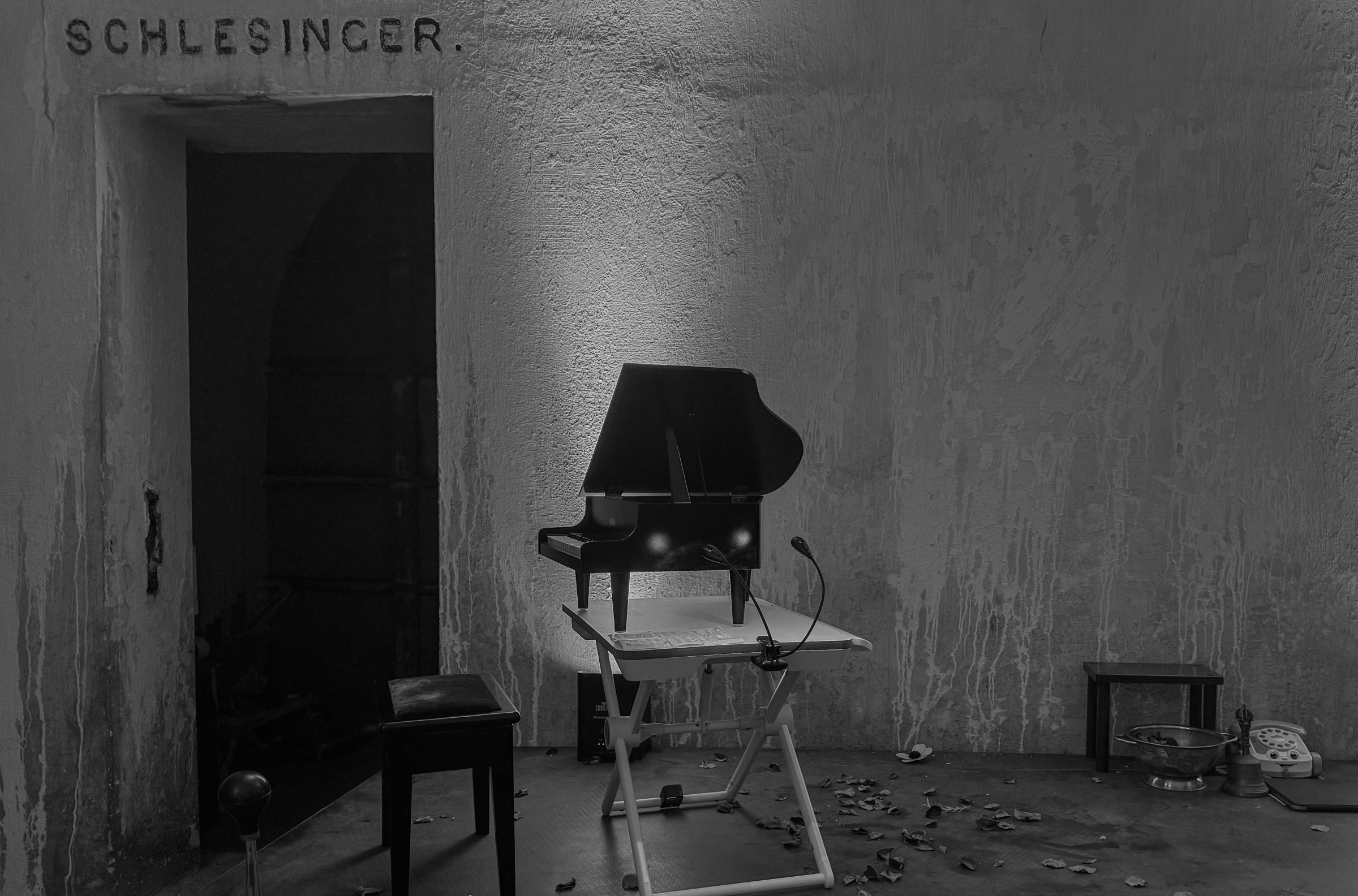 A toy piano set up in front of a doorway from the October 3, 2024 performance of Curios in the Catacombs by Margaret Leng Tan at Green-Wood Cemetery in New York