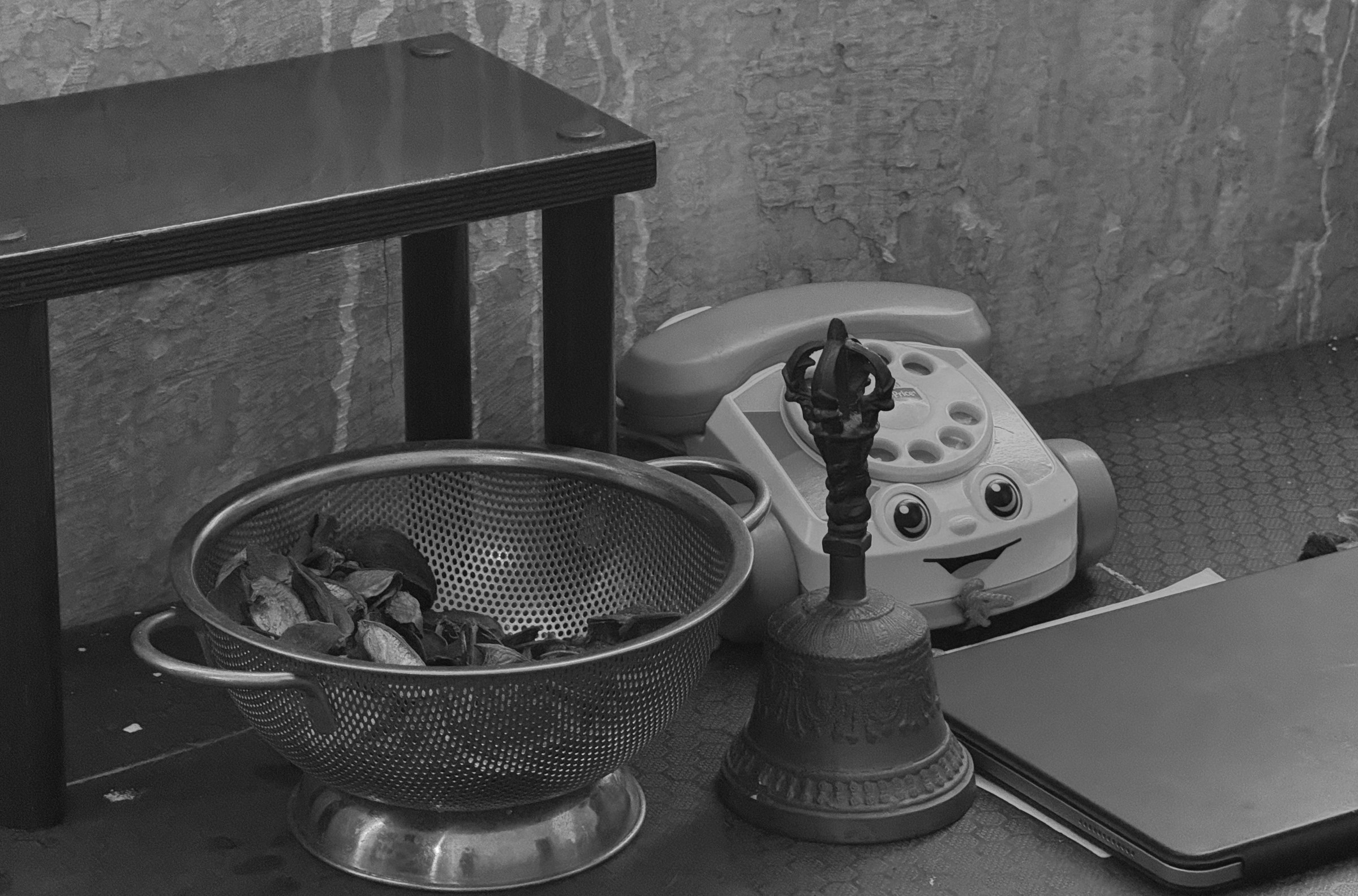 A toy phone, a bell, and an iPad from the October 3, 2024 performance of Curios in the Catacombs by Margaret Leng Tan at Green-Wood Cemetery in New York