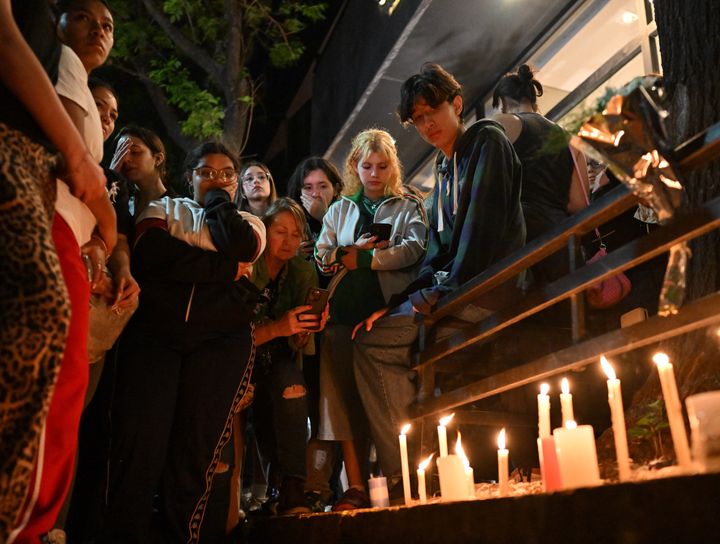 Fans gathered Wednesday outside the hotel where Payne had been staying to mourn him.