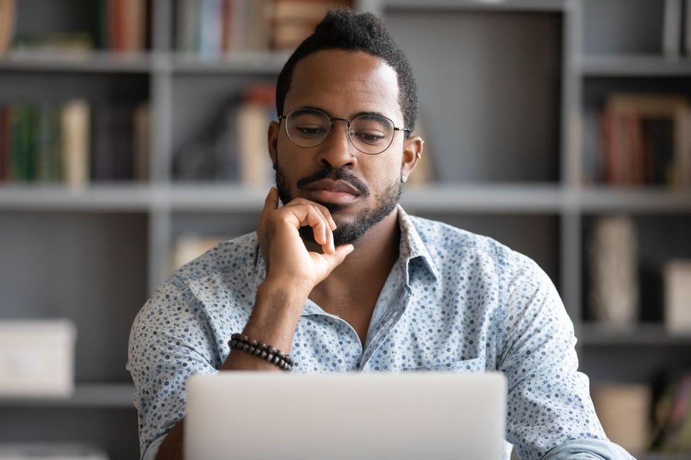 man questioning computer