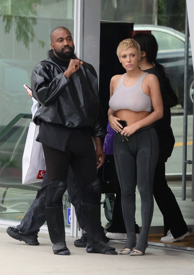 Kanye West is seen in good spirits while shopping at Supreme with Bianca in May 2023