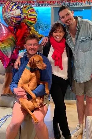 Fiona with her two sons and their pet dog