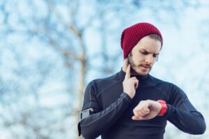 Man checking his heartbeat or heart rate