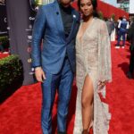 Travis Kelce, left, and Kayla Nicole appear at a red-carpet event on July 18, 2018, in Los Angeles, California.