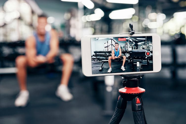 Man filming in gym