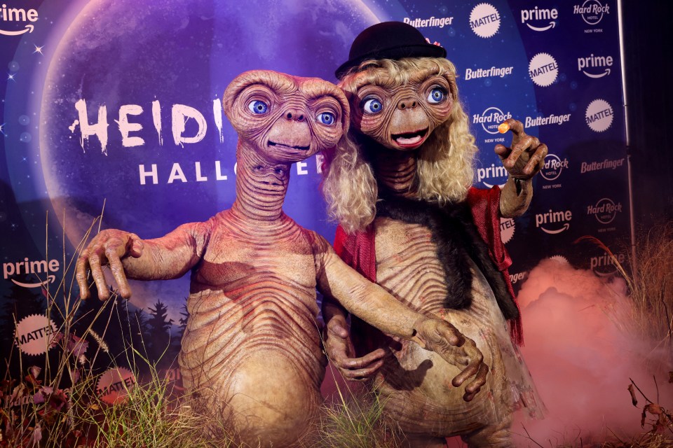 Heidi and husband Tom put on a cute display dressed as ET to her 23rd annual Halloween party in New York