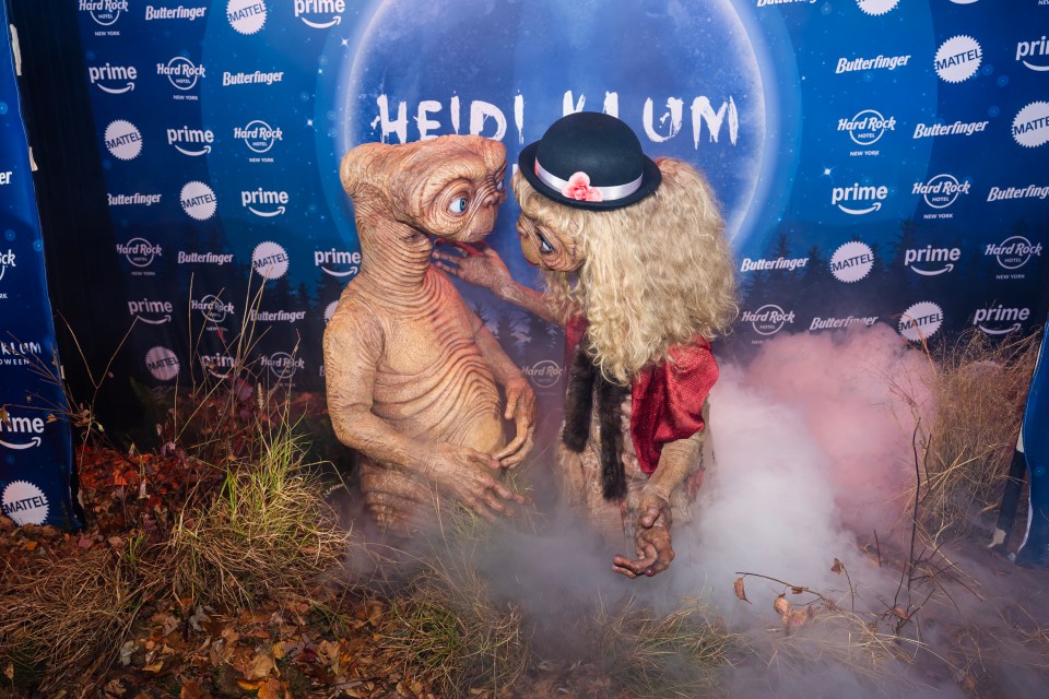 Tom and Heidi crash-landed onto the red carpet dressed as E.T. for her annual Halloween party in New York