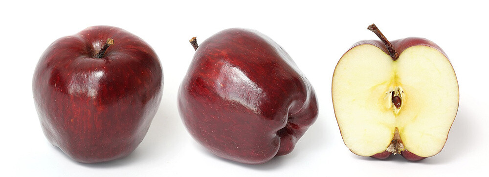 Red Delicious apple and its cross section isolated on a white background.