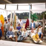 Group of men on a deck at the beach